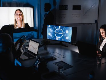Trading teamwork doing online meeting for blockchain research inside hedge fund office - Focus on woman face